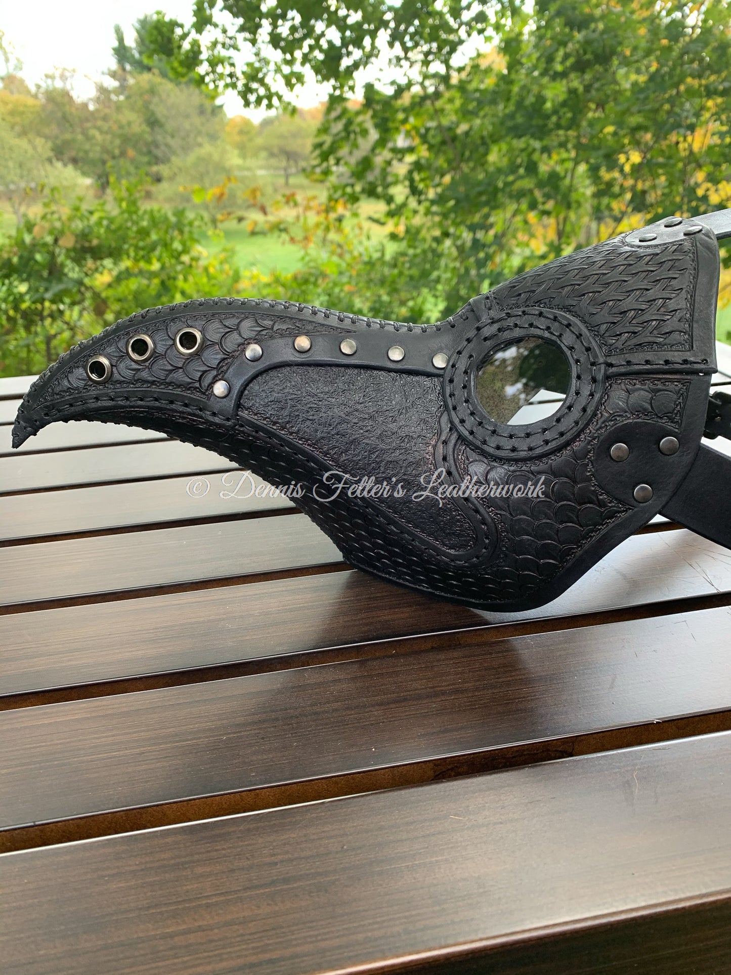 leather plague doctor mask stamped - black in color - side view