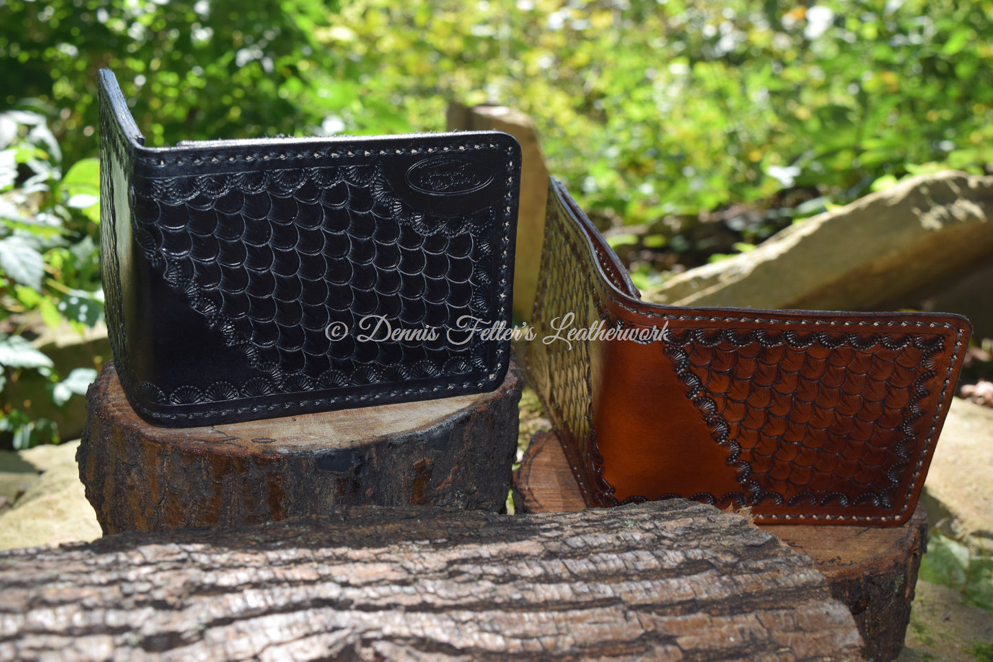Another view of the black and brown leather wallets showing the exterior stamping